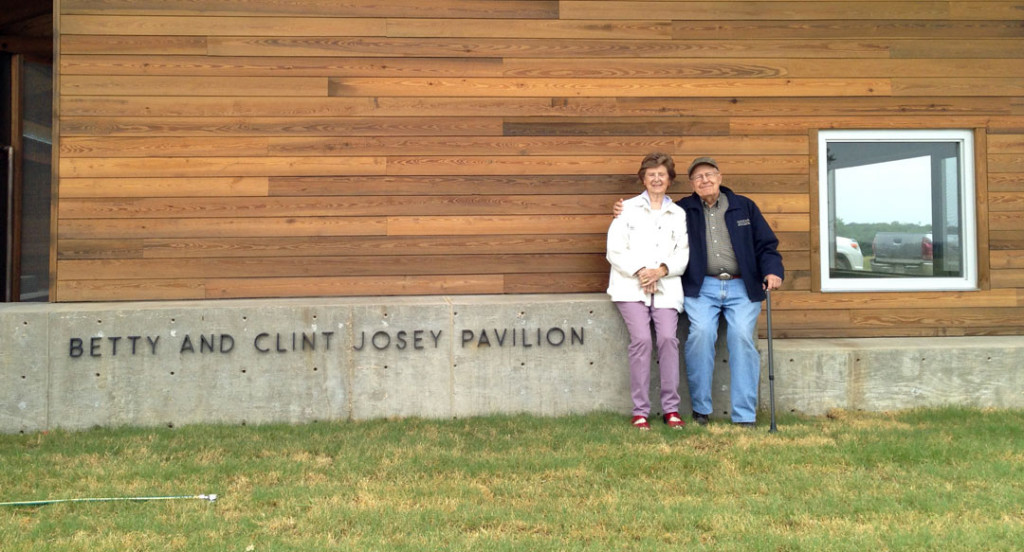 Betty and Clint Josey standing by the pavilion.